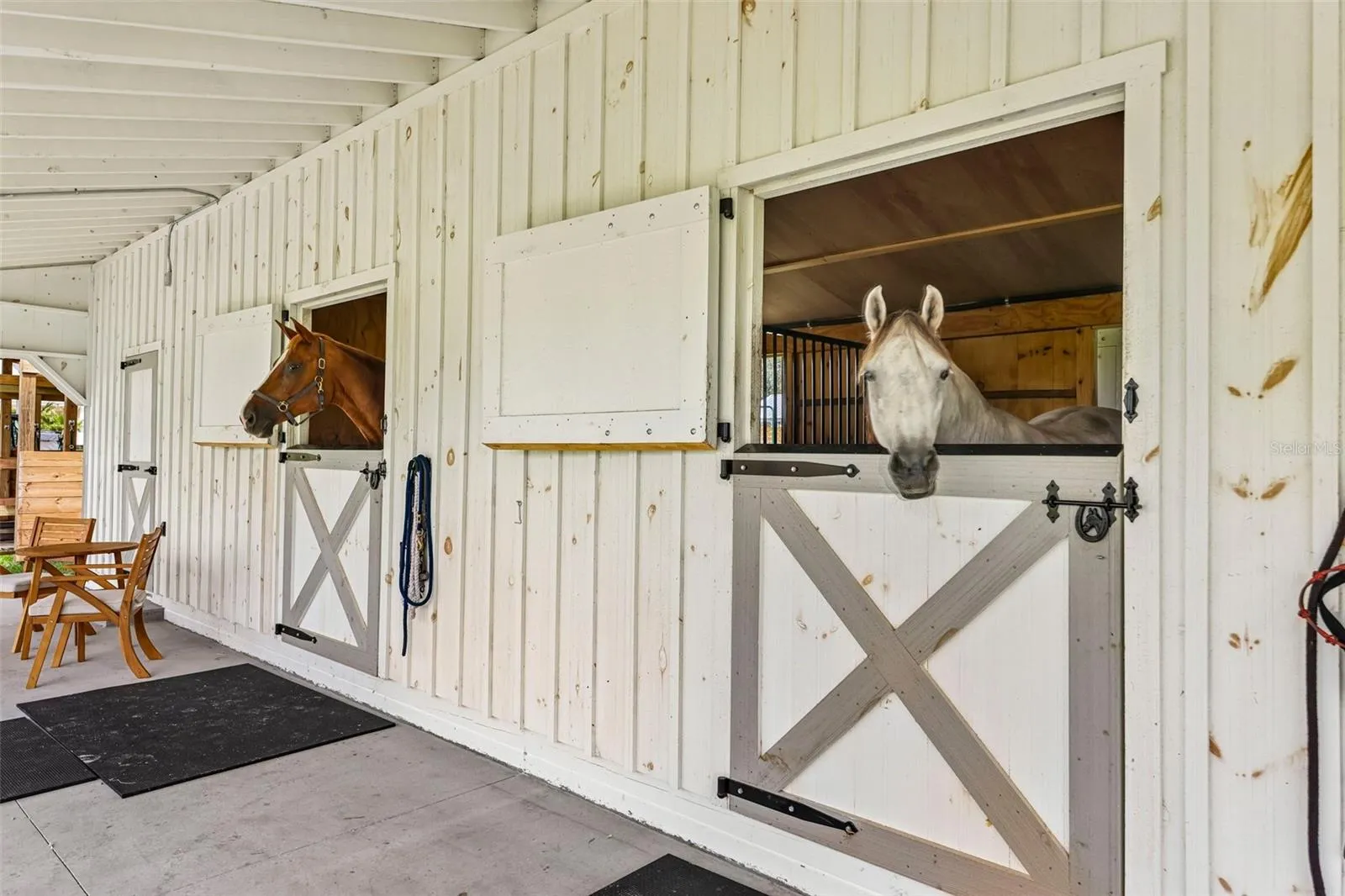 Dutch-style stall doors with durable metal top trim designed to help prevent horses from chewing the wood.