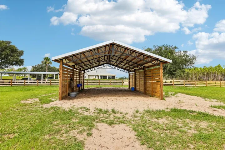 The 24x26 pole barn in Paddock #3 provides a spacious, shaded run-in area for horses during turnout.