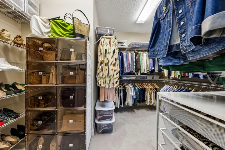 Walk-In Closet between Primary Bedroom and Primary Bathroom