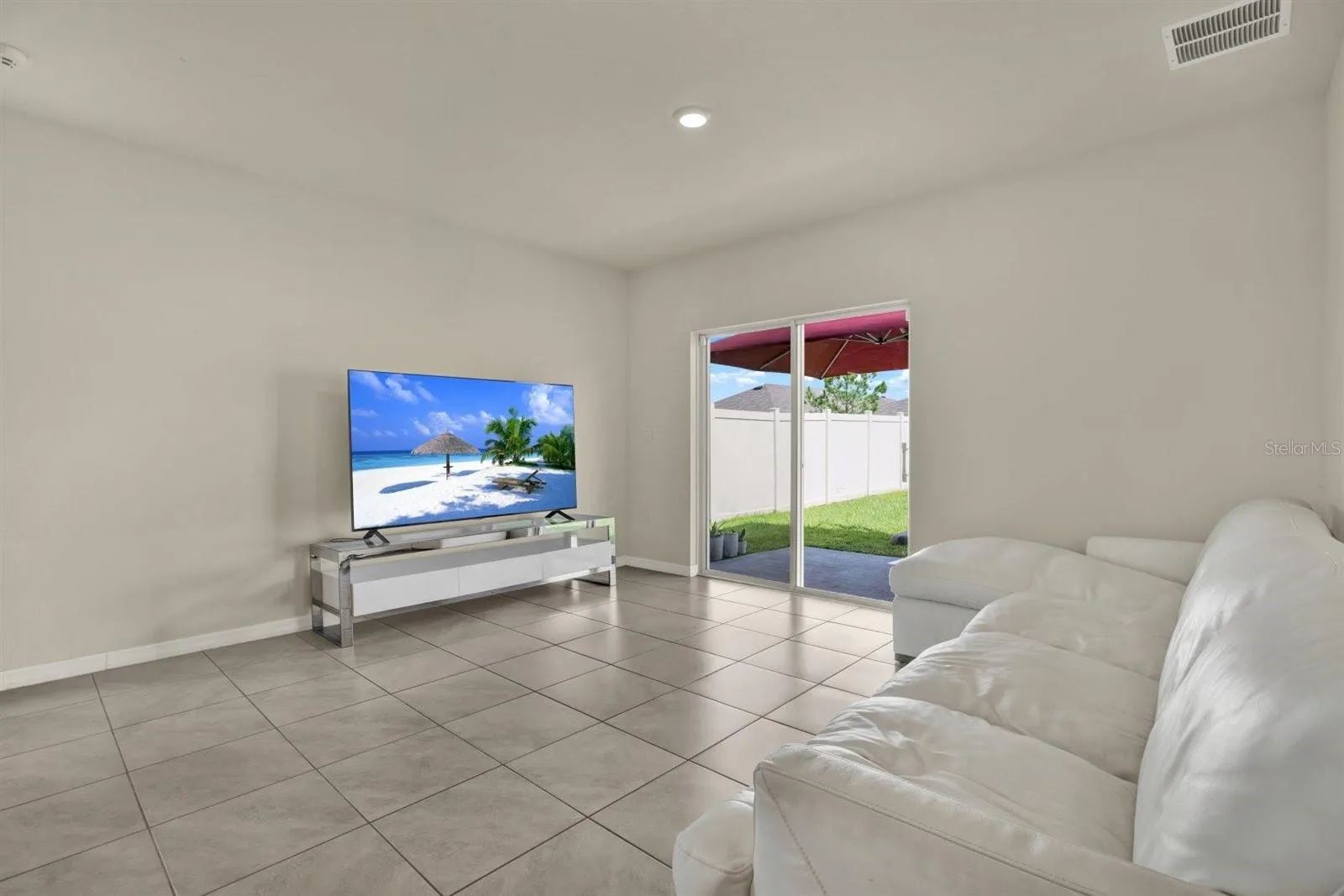 Sliding glass door straight out to the private patio