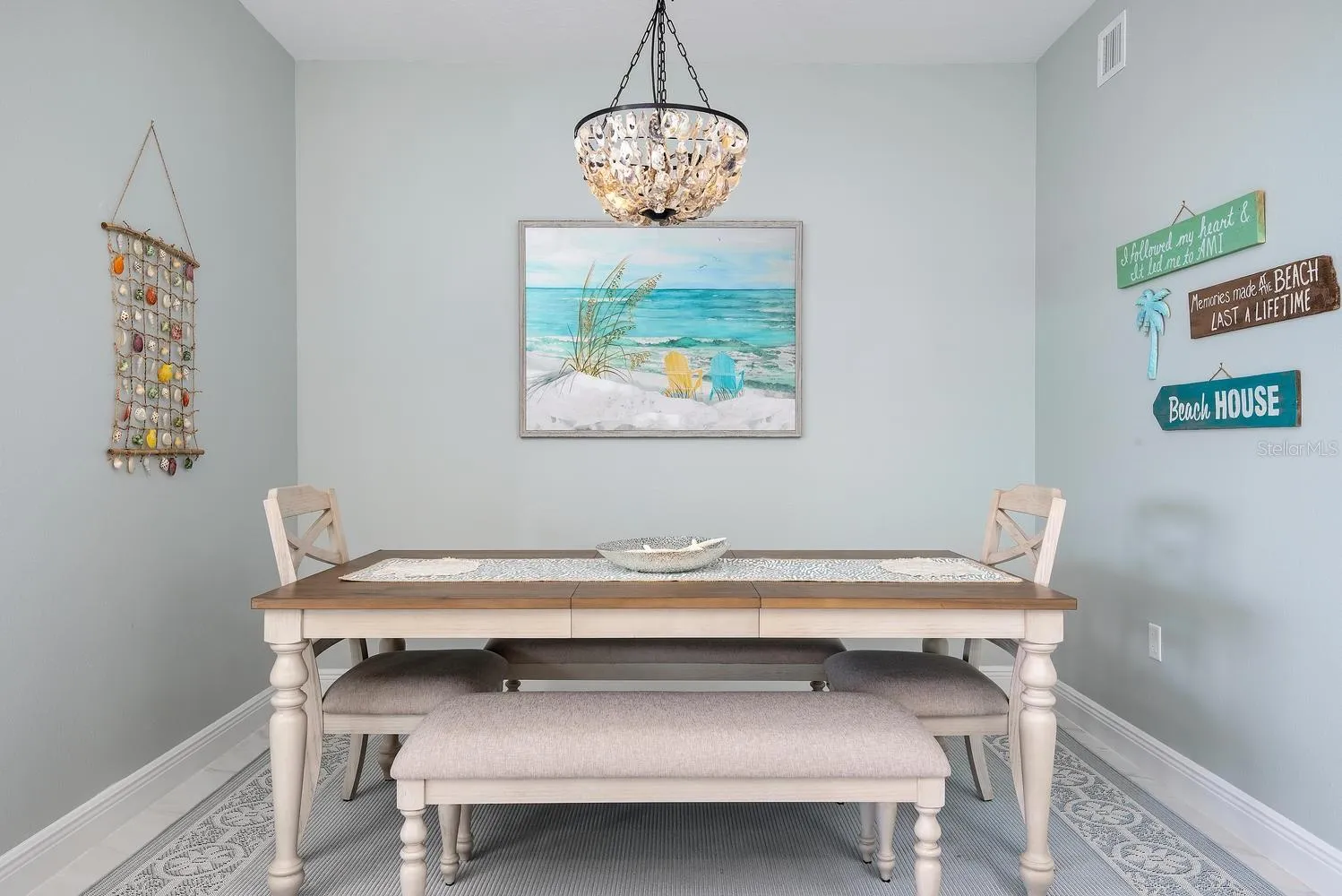 dining area with oyster chandelier