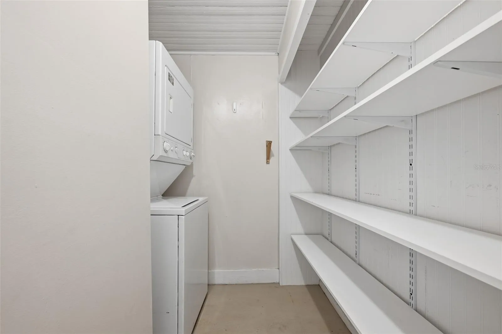Another pantry with laundry area off kitchen.