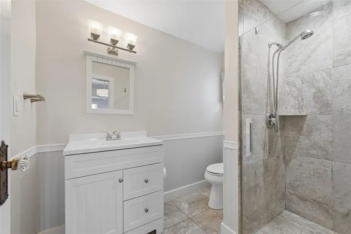 Downstairs full bathroom with shower.