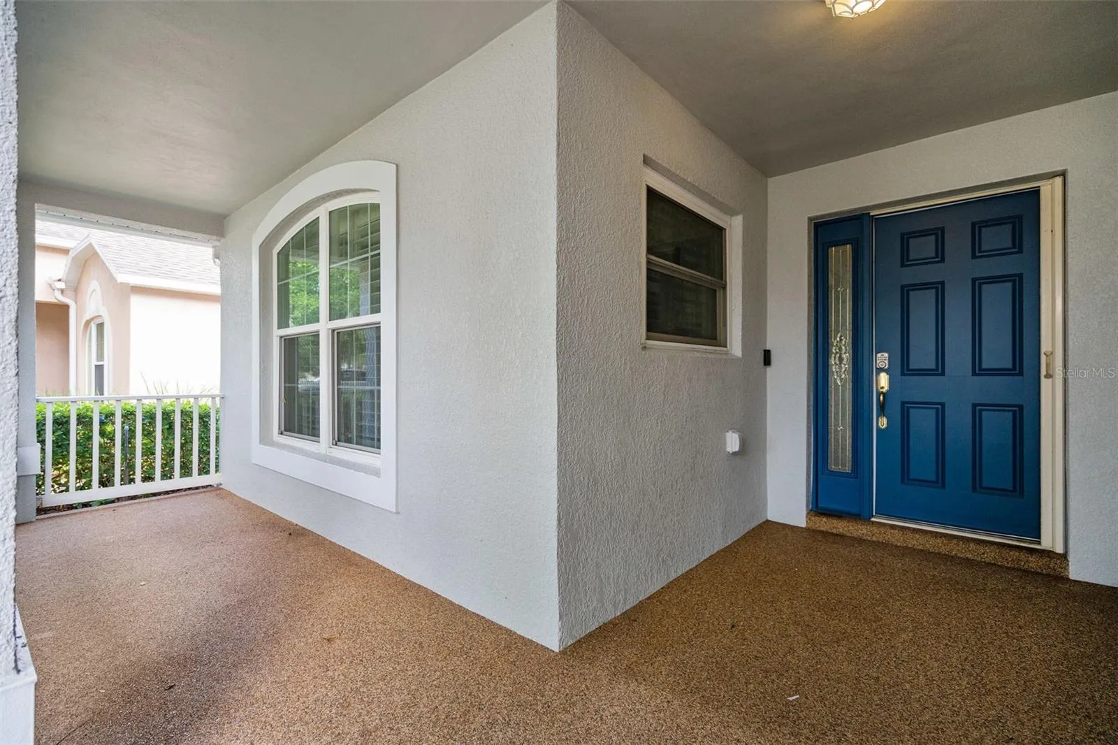 large porch with river rock stone floor covering.