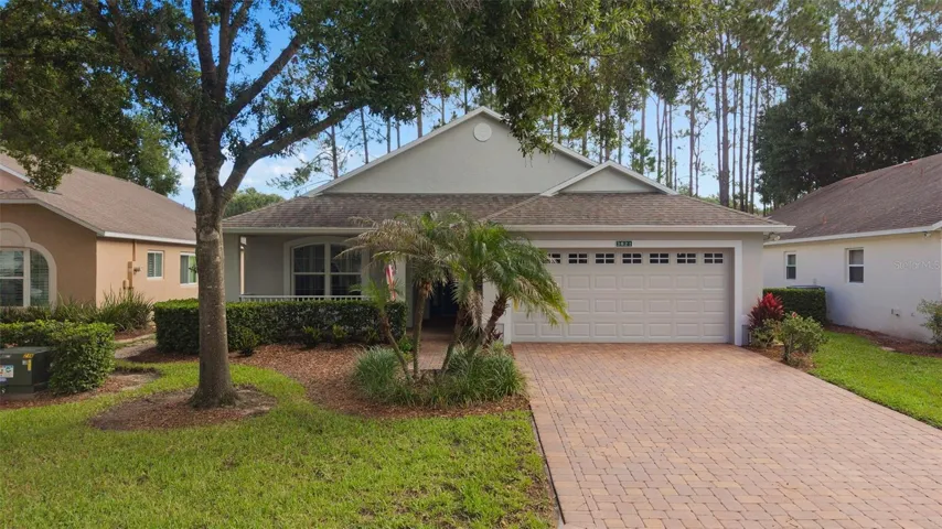 Beautiful paver driveway and home sits on the 9th hole of the Kings Ridge Championship Golf course