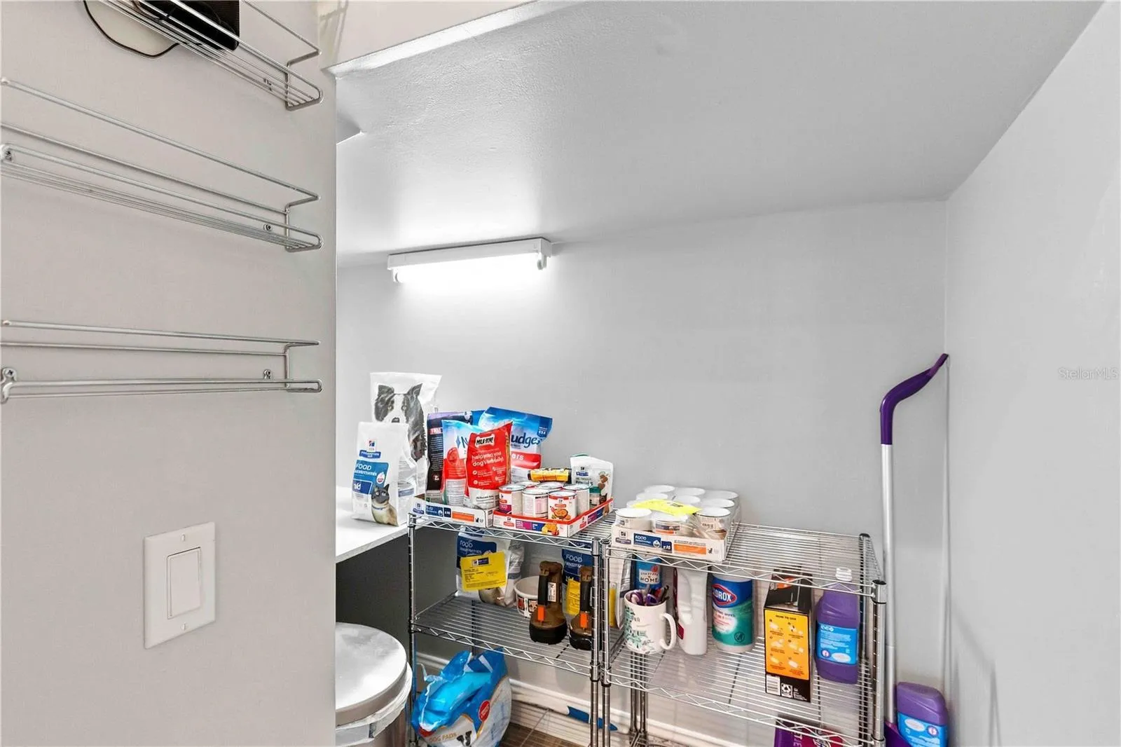 Extra storage tucked under the stairs — great for pantry overflow, cleaning supplies, or seasonal items