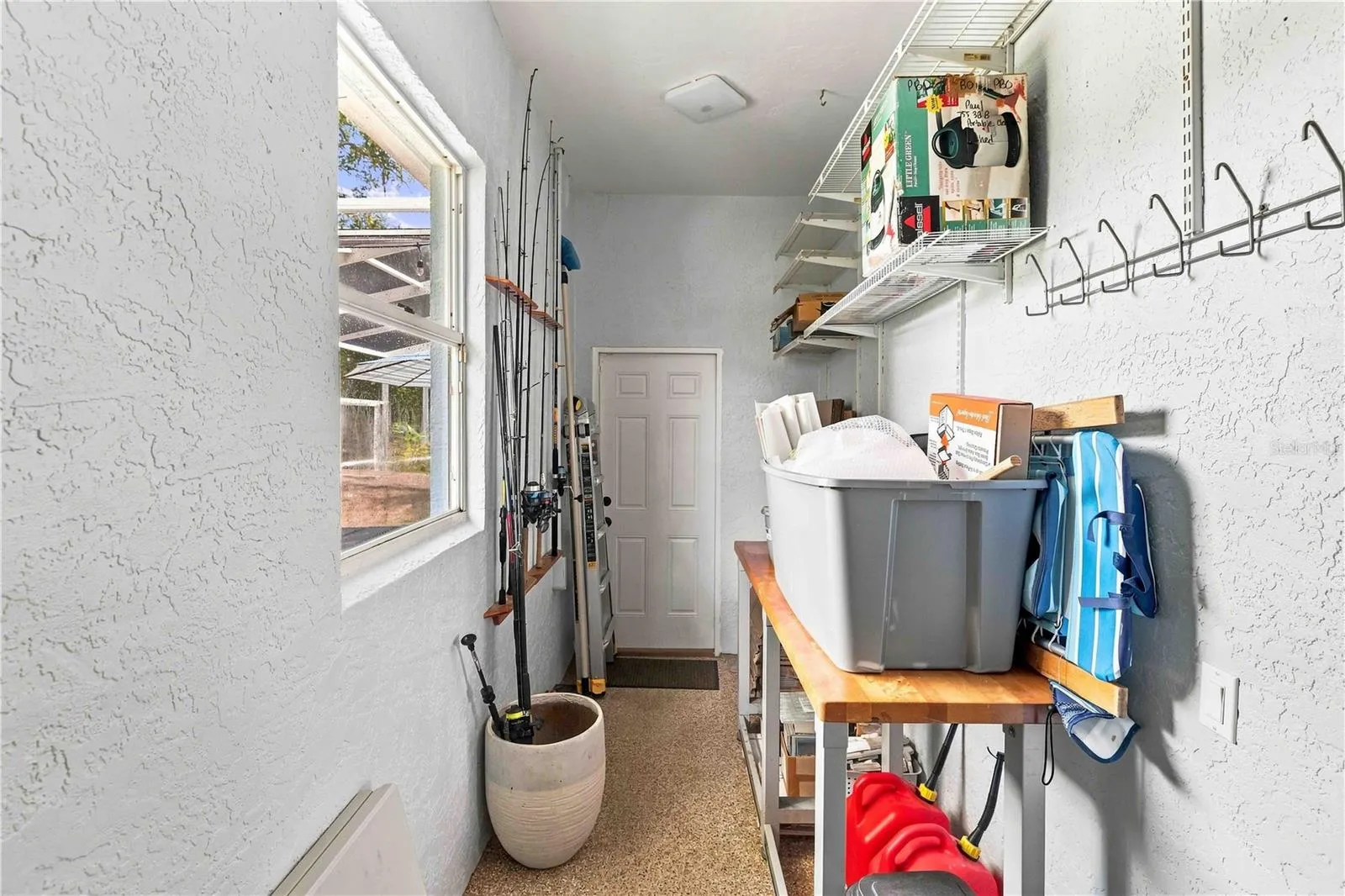 A handy storage room off the lanai — ideal for fishing gear, pool toys, and outdoor equipment