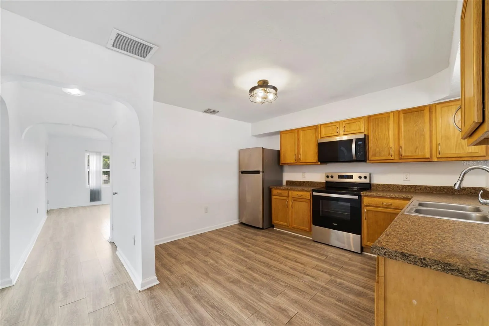 Unit 526 - Arched doorways add character to the space.