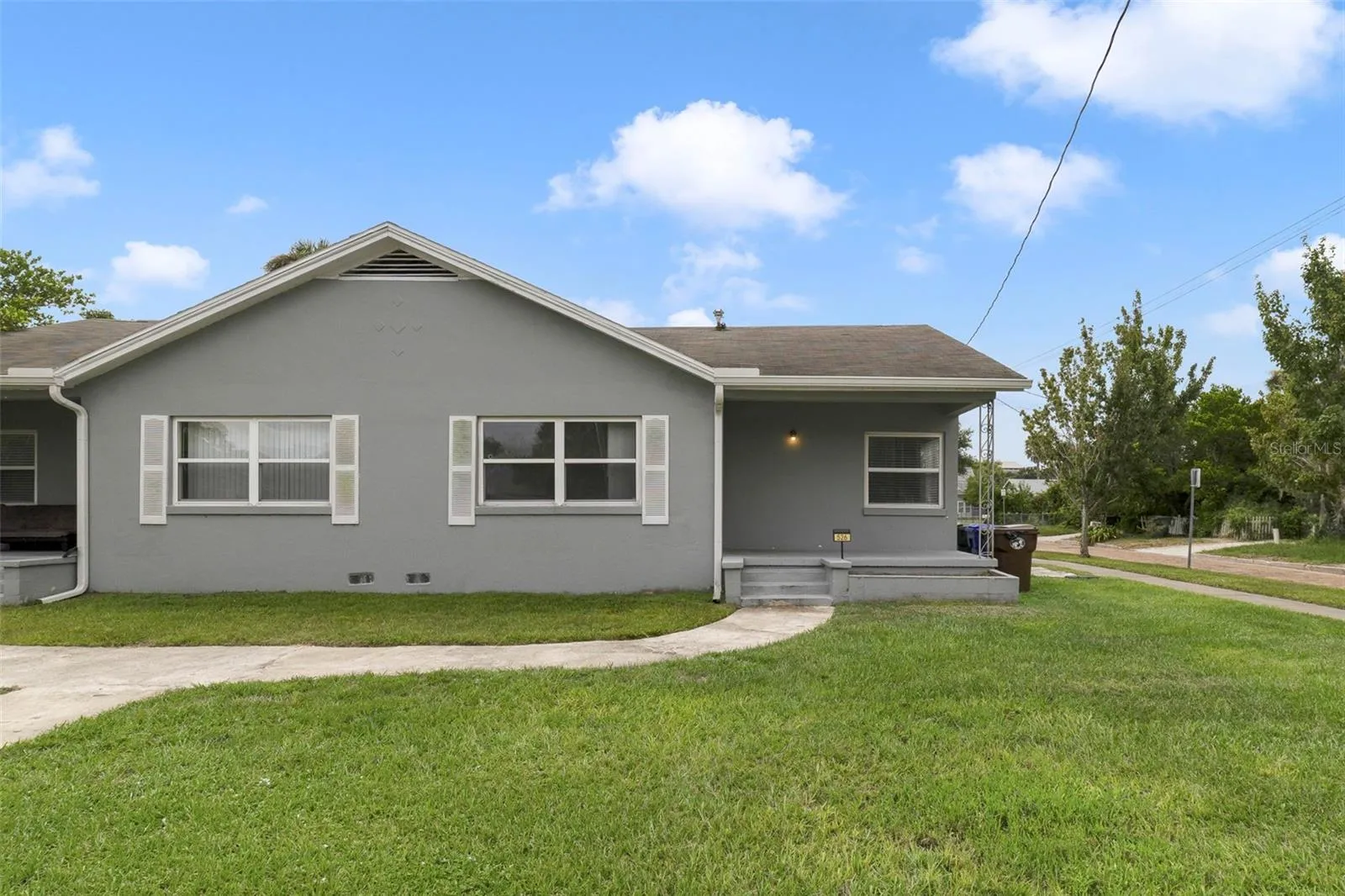 Covered front porches, green space in the front.