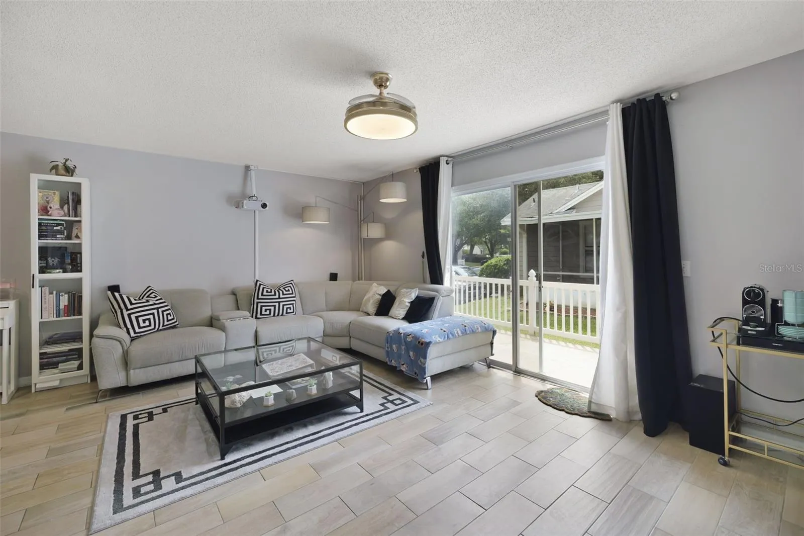 Sliding glass doors off the living area open to a fenced patio.