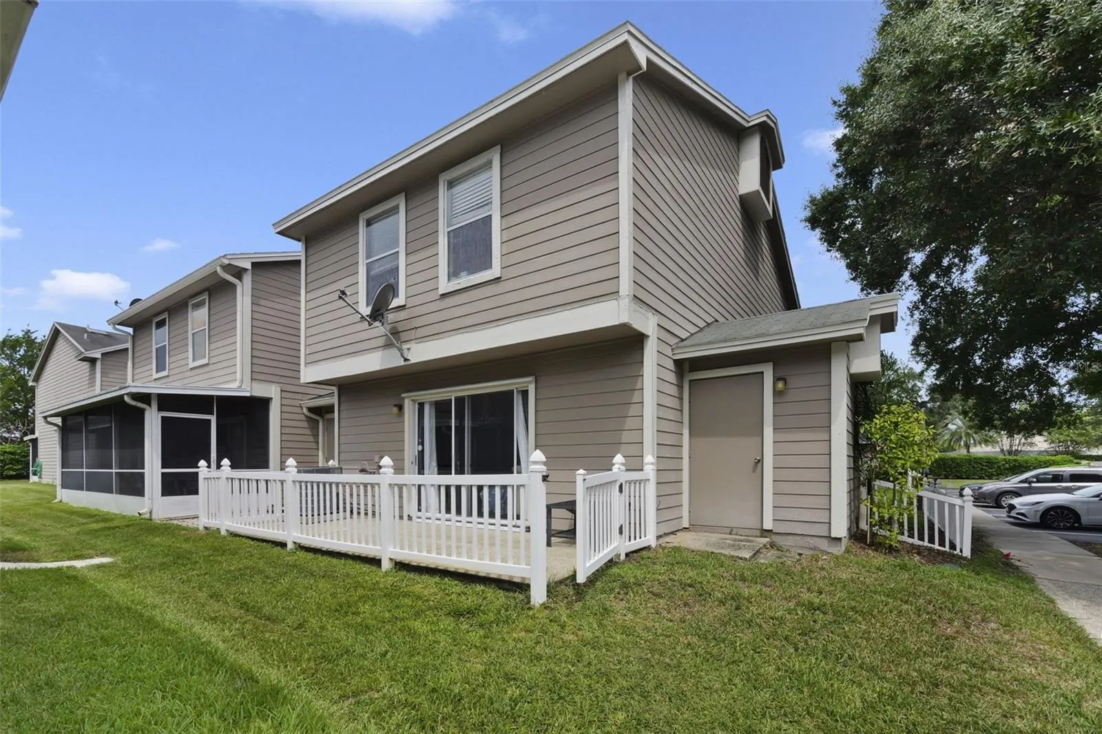 End/corner unit with additional outdoor storage and a large fenced patio off the living area.