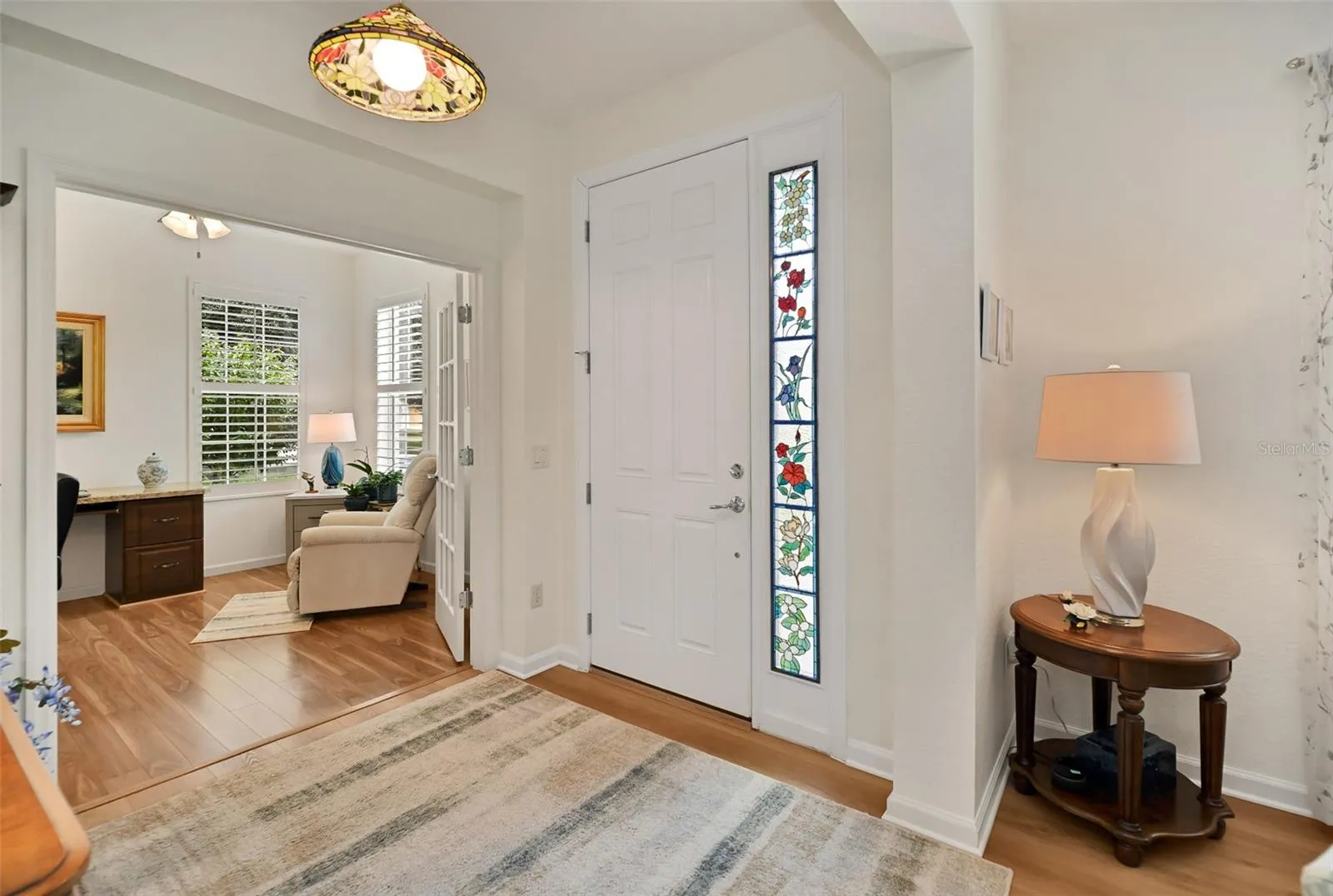Foyer with custom stained glass side-light insert