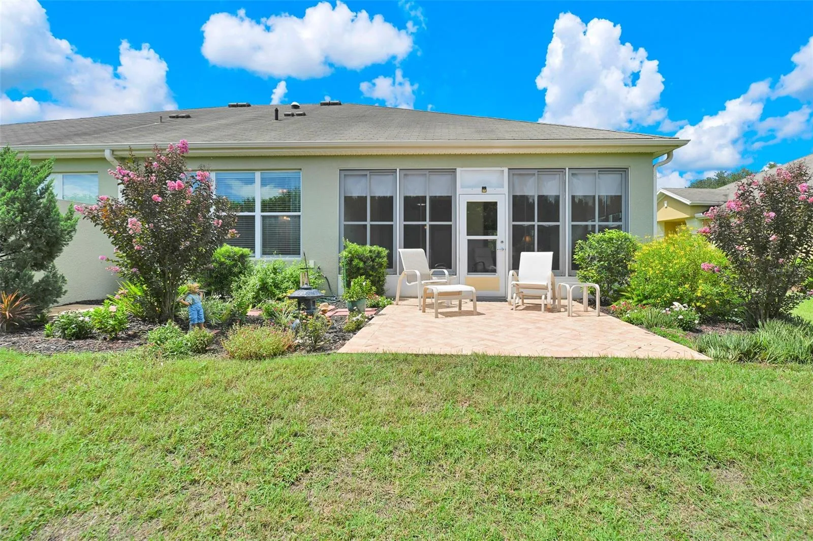 Rear private outdoor paver patio & garden area