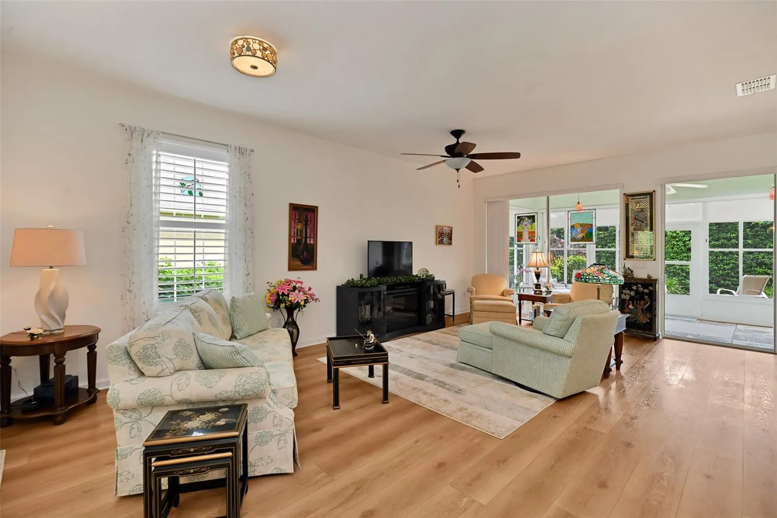 Open concept Living/Dining Areas with luxury vinyl plank flooring and included fireplace console.
