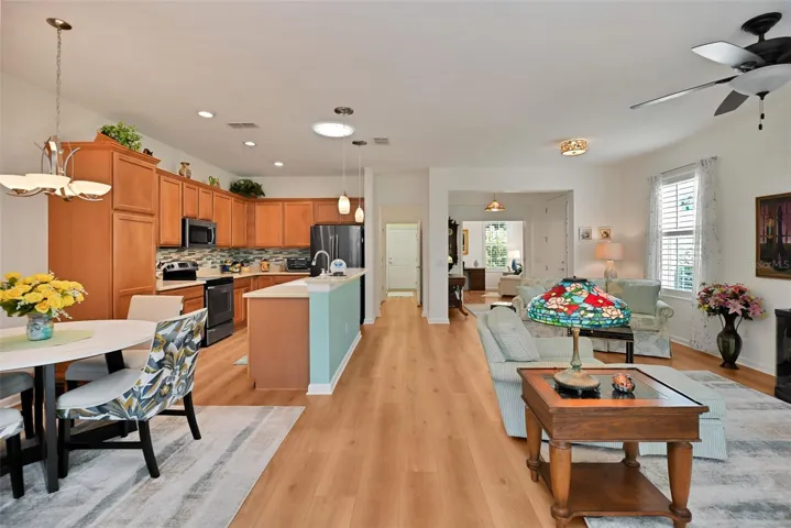 Open concept Living/Dining/Kitchen Areas with luxury vinyl plank flooring.