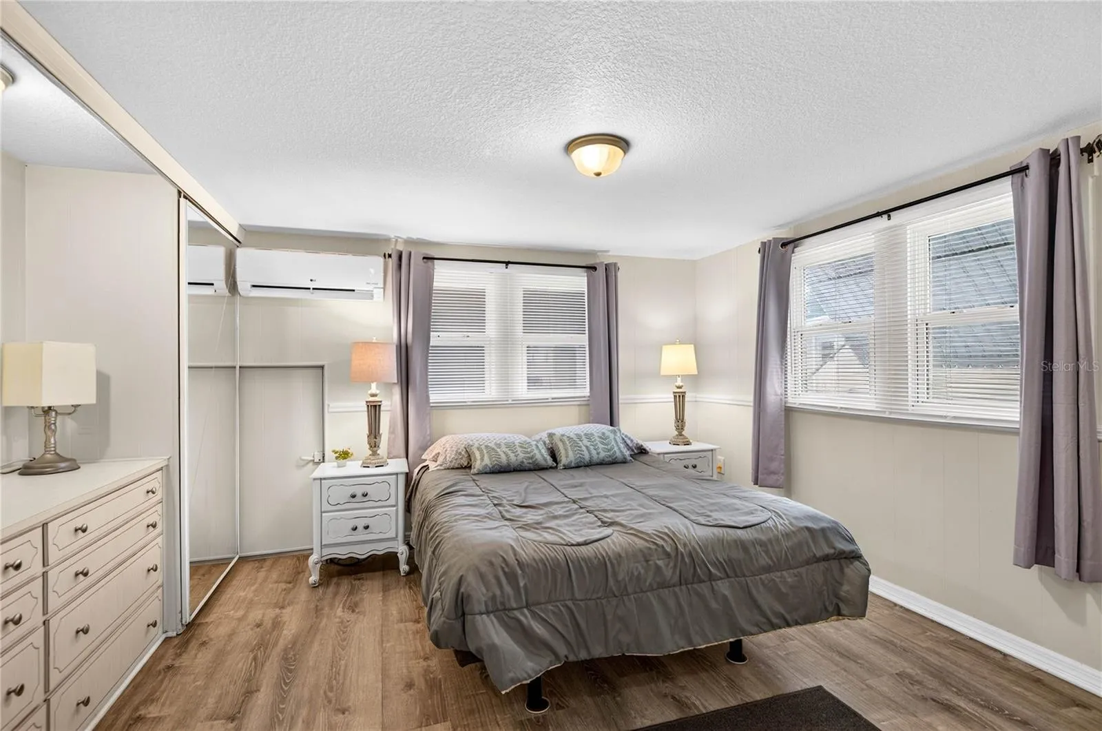 Primary bedroom with built in chest of drawers.