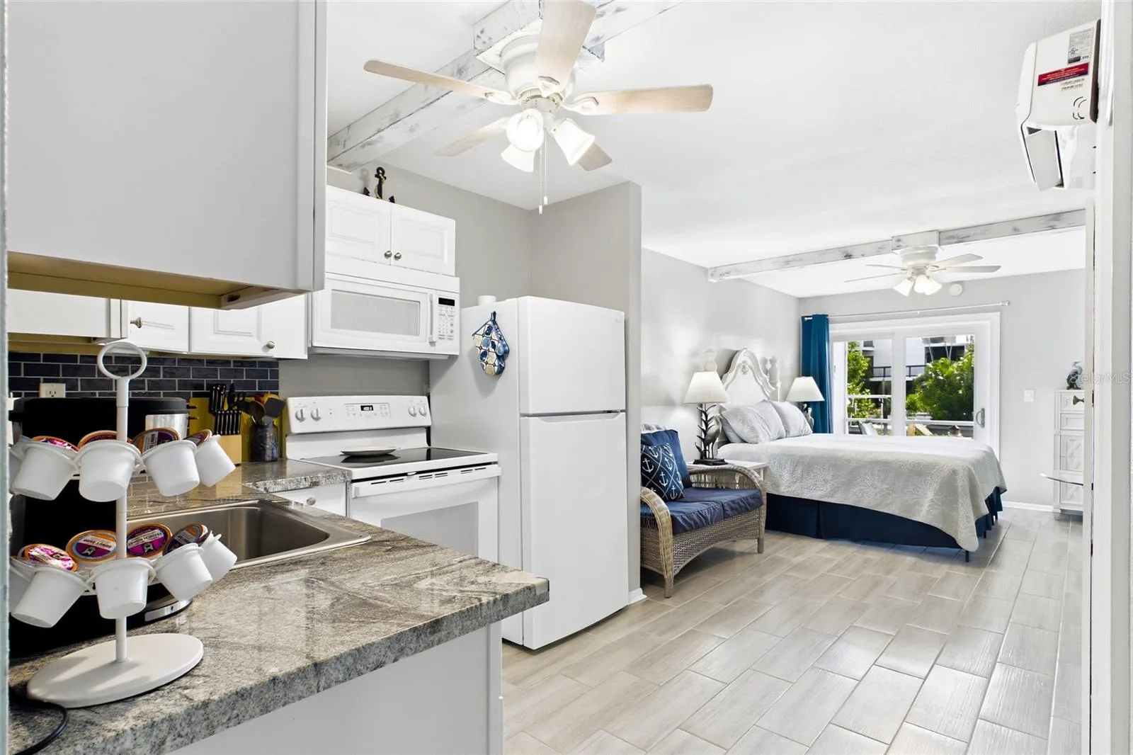 THE CRANE ROOM Each thoughtfully designed studio features an open bedroom and living area, creating a comfortable and functional space with a fresh coastal feel.