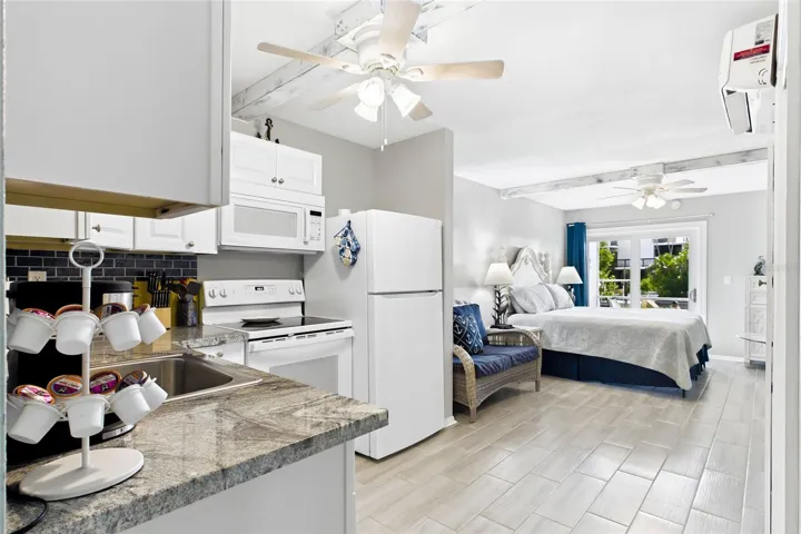 THE CRANE ROOM Each thoughtfully designed studio features an open bedroom and living area, creating a comfortable and functional space with a fresh coastal feel.
