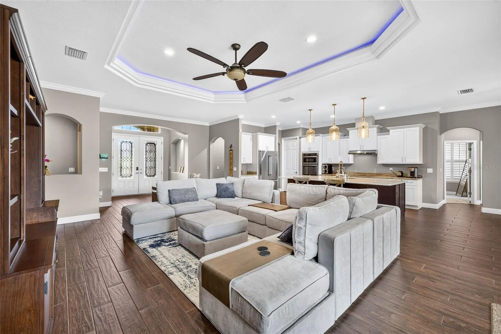 Living Room with view of kitchen and foyer