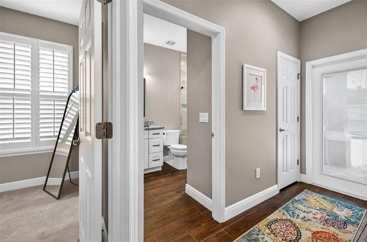 Bedroom 3 with connected bathroom. Door to patio