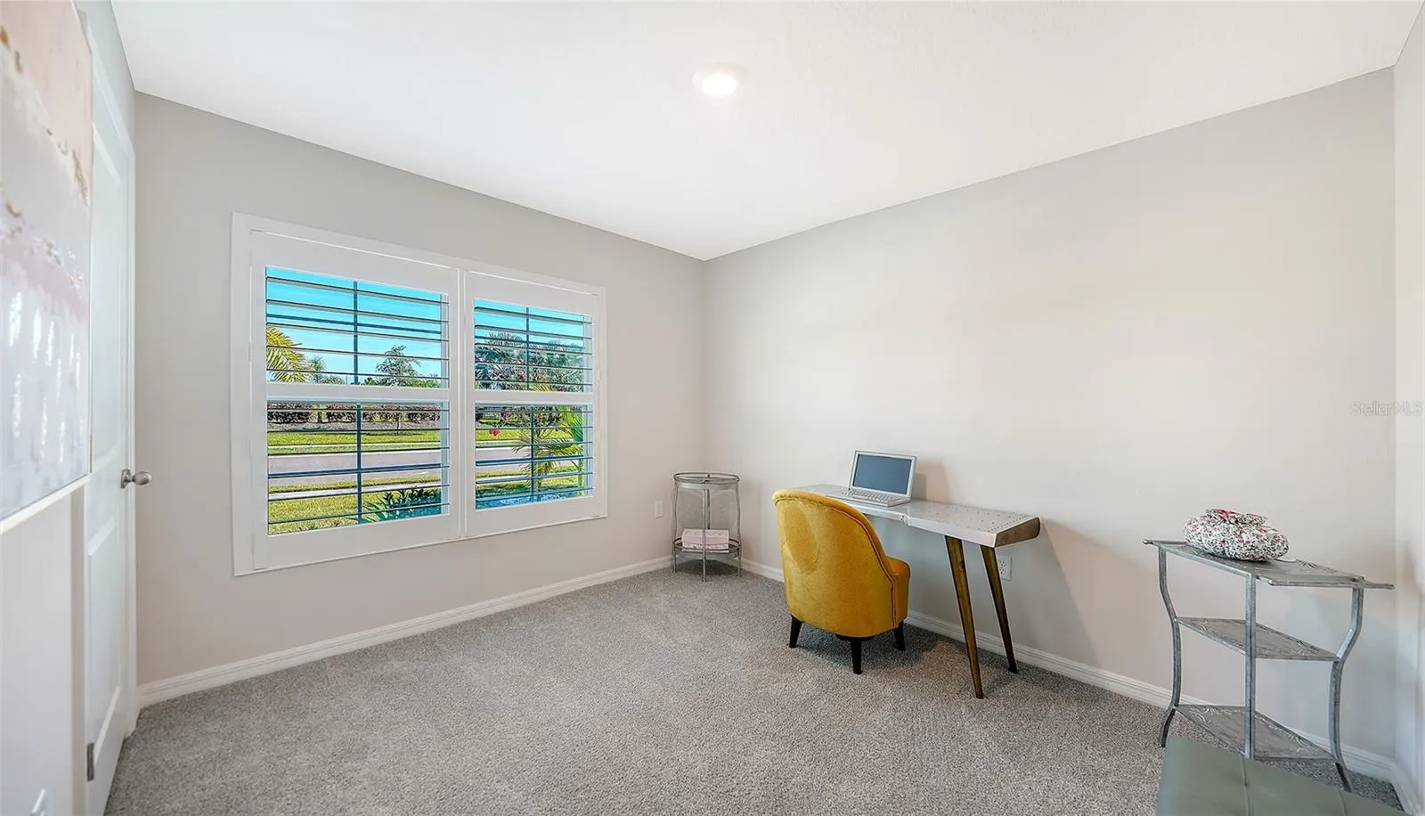 Guest bedroom in the front of the home overlooking the pond across the street.