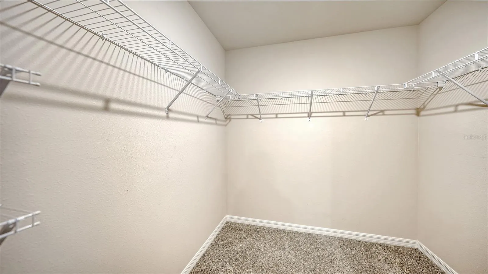 Primary bedroom spacious walk-in closet.