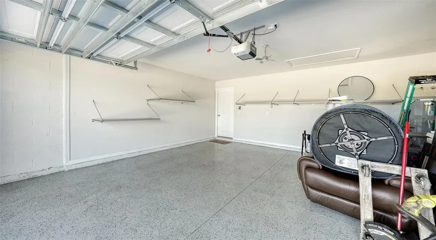 The garage has upgraded epoxy flooring as well as storage racks for your convenience.