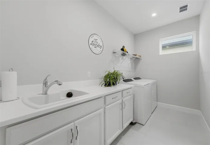 Inside Laundry room w/mop sink and lots of space