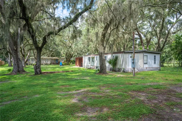 Situated on 1.77 acre lot are 2 mobile homes . 1-double wide with a car port area. 1-single wide. each has its own septic bit share a deep water well.