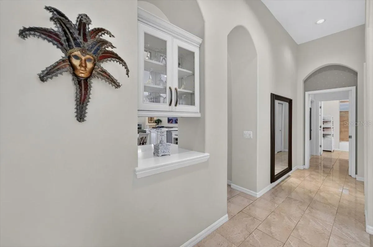 Hall to your right towards Kitchen