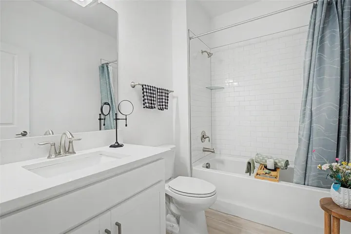 Secondary Bath with Quartz countertops and bathtub
