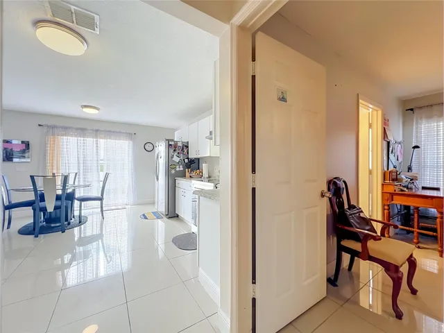 Dinette off kitchen is next to Primary bedroom on 1st floor