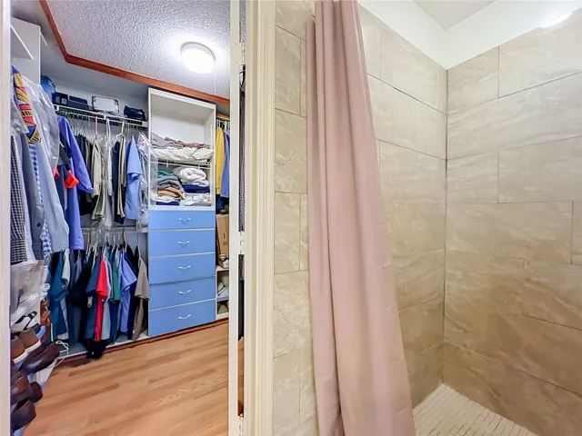 Walk in closet is next to the shower