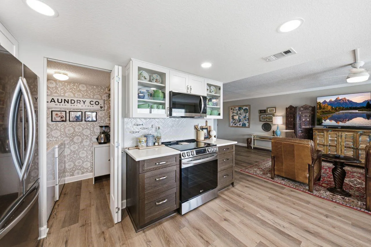 Laundry room is right of kitchen