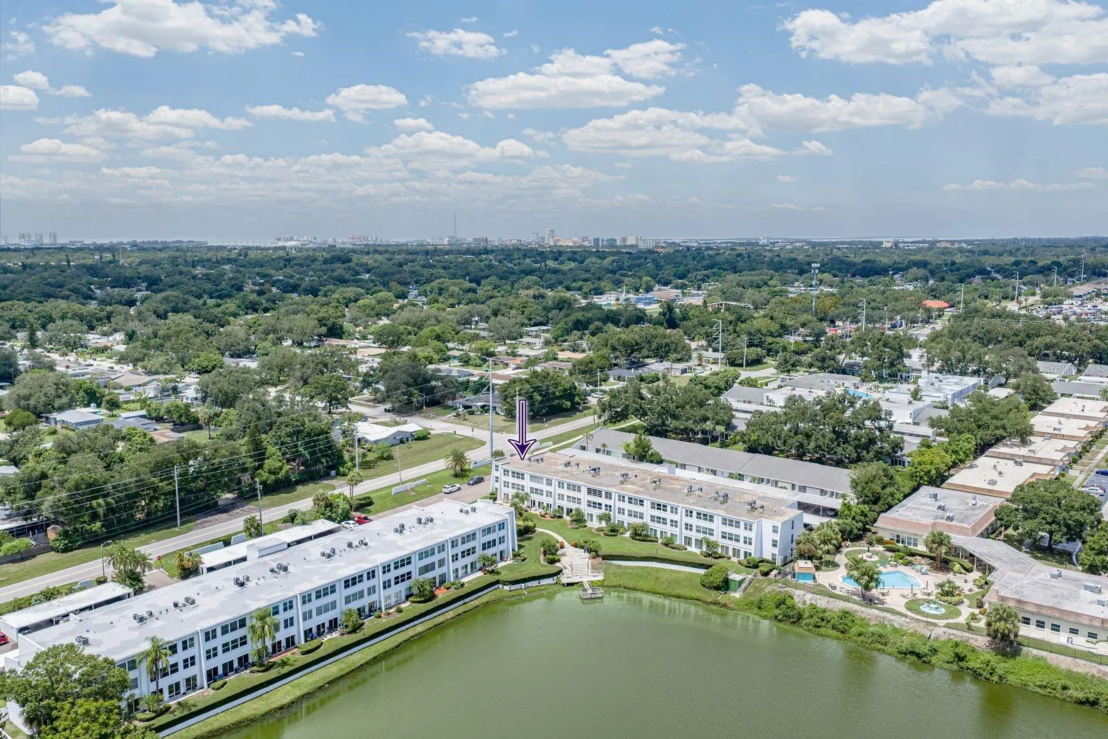 Camera facing NW. Downtown and Clearwater beach on the horizon. FYI, the pool in lower right corner is NOT part of Penthouse Groves