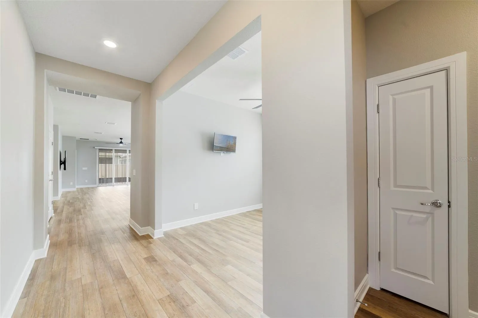 From entry looking down the hall with the Bonus room and closet on the right.
