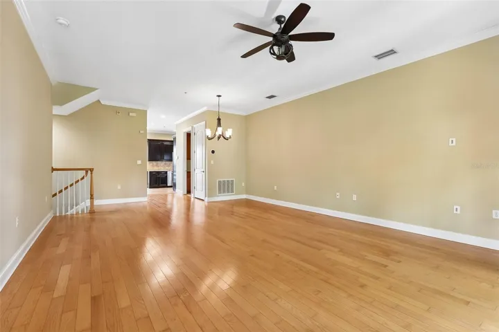 Living room toward 1st floor stairs and kitchen