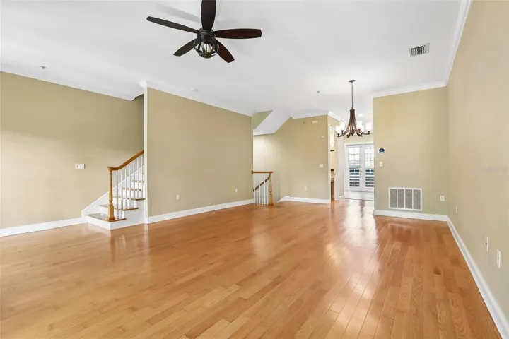 Living room toward 2nd floor stairs
