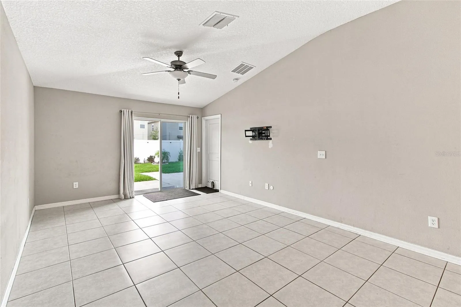 Living area with slider to backyard