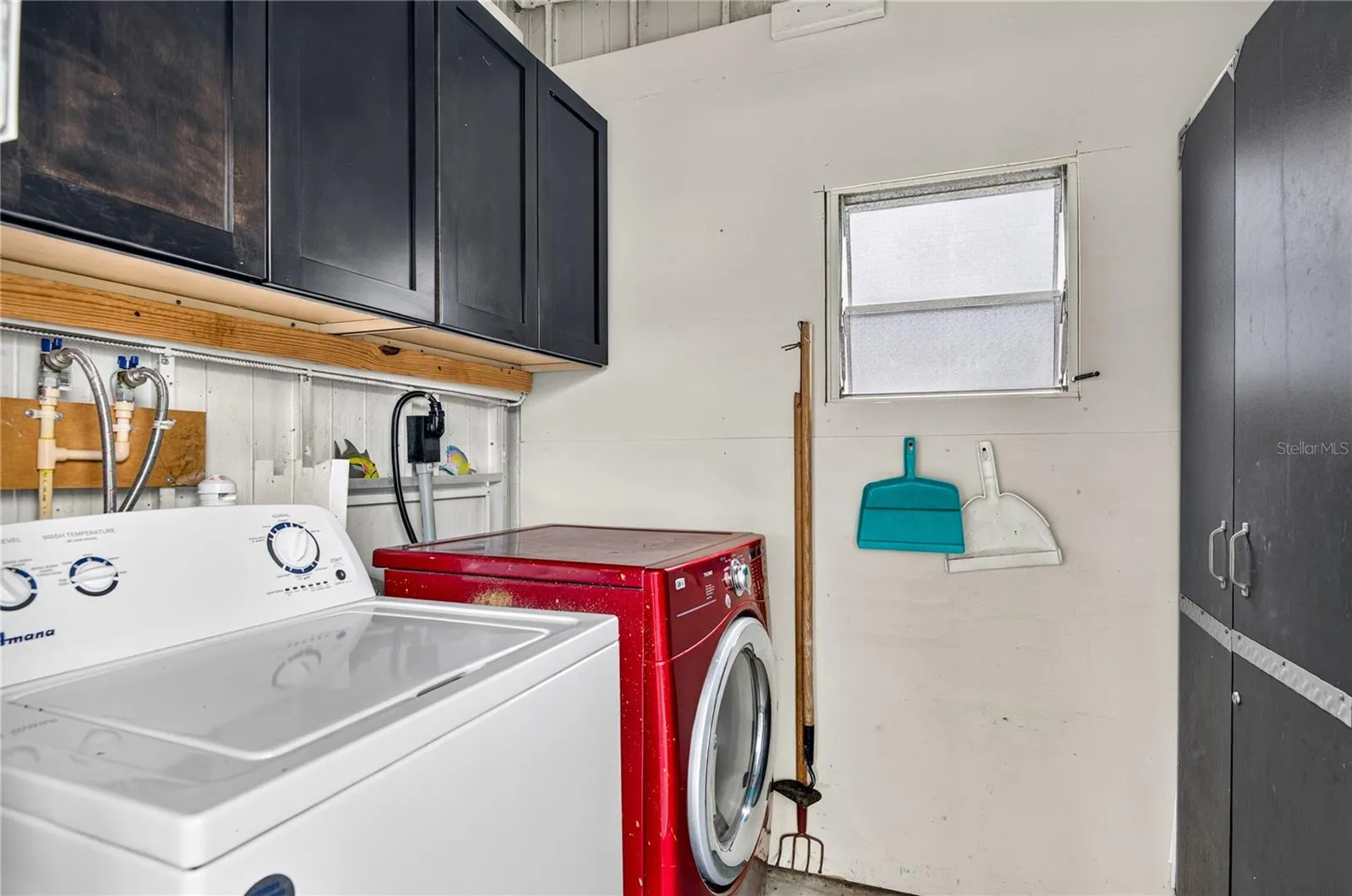 Washer/dryer included inside the shed in carport.