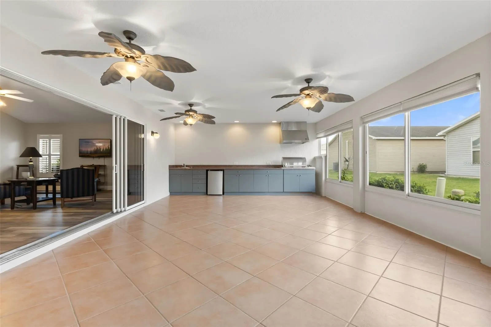 Enclose Lanai with summer kitchen