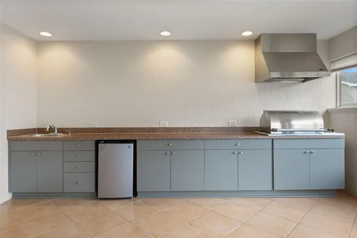Enclose Lanai with summer kitchen