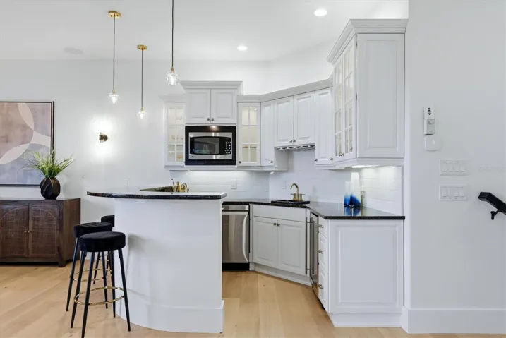 Second Floor kitchenette with microwave, sink and mini fridge