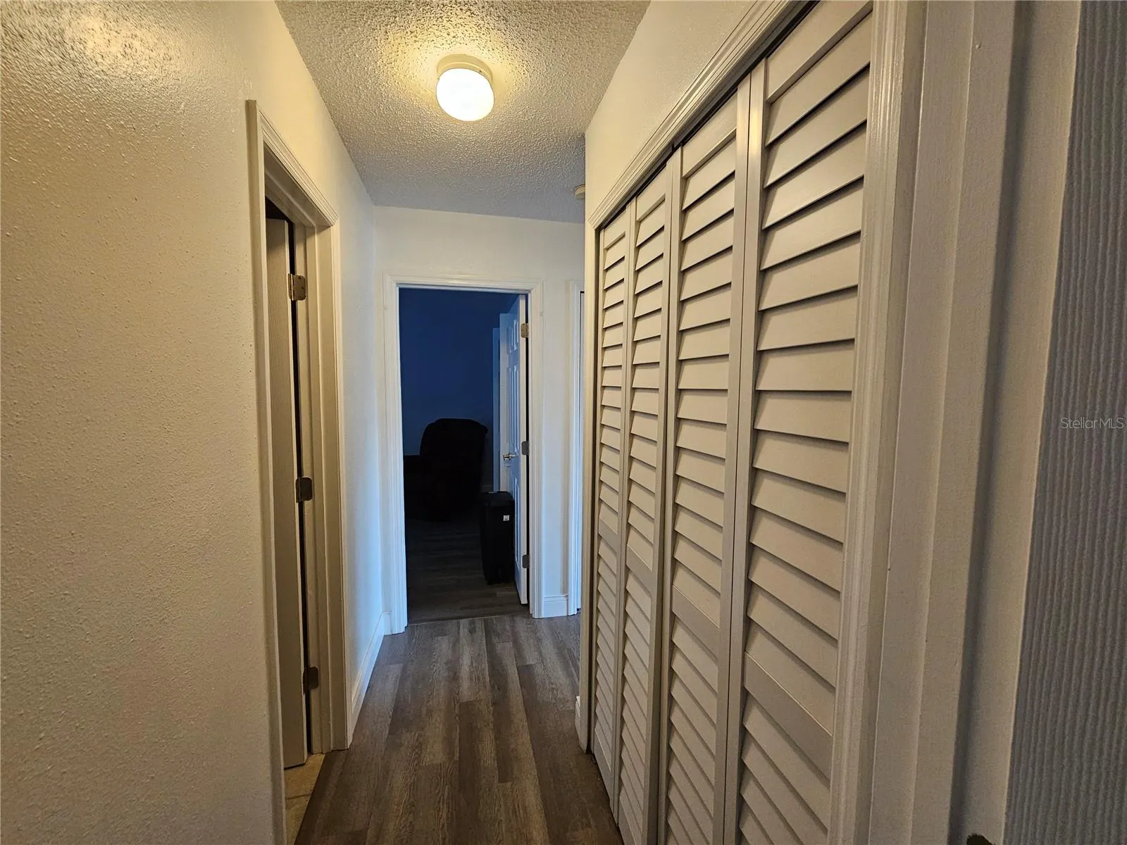 Hallway Between Bedrooms with 2nd Bathroom and Laundry Closet