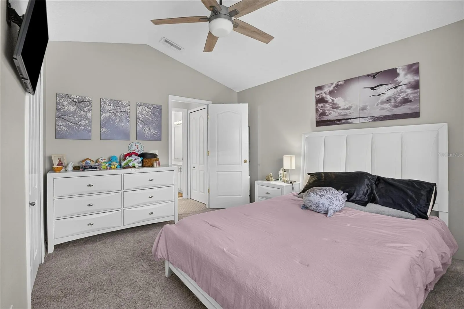 Spacious secondary bedroom offers plenty of room for a large bed and additional furnishings.