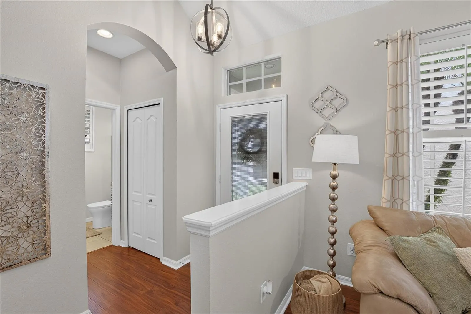 Welcoming entry with convenient half bath nearby.