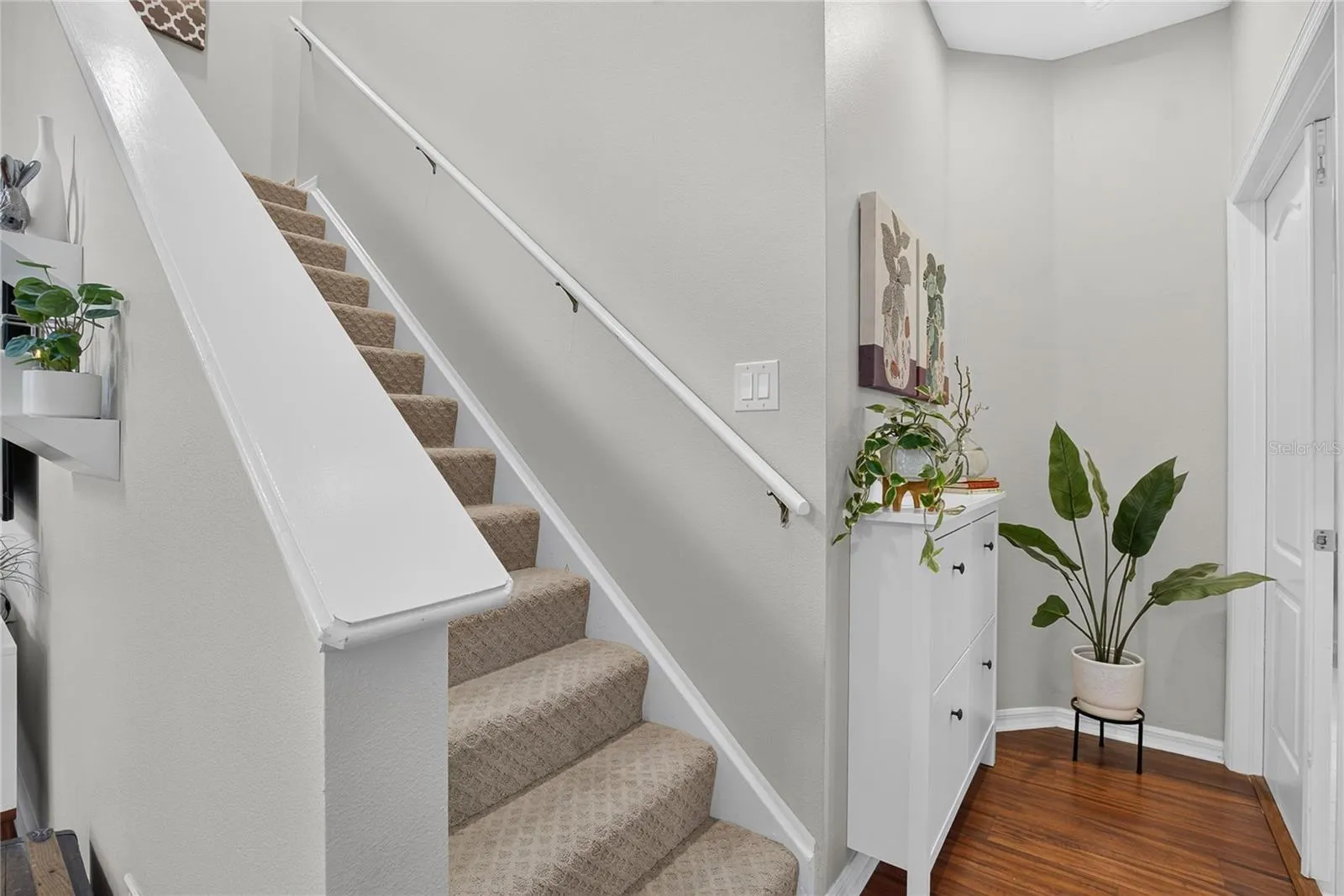 Stairway leads to the second floor featuring a spacious loft, two additional bedrooms and full bath