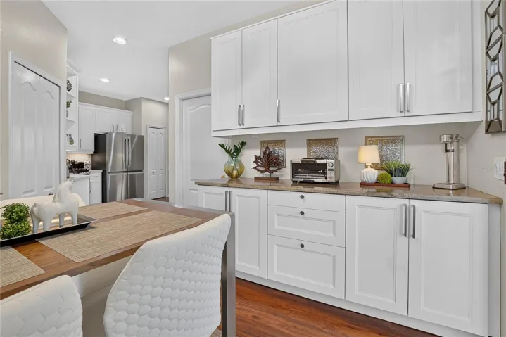 Built-in cabinetry provides exceptional additional storage and serving space.