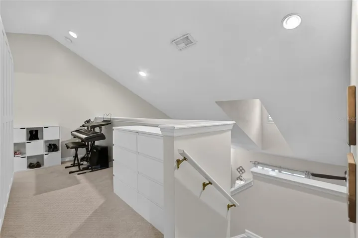 Open second-floor loft provides flexible space for a home office, reading area or hobby space.