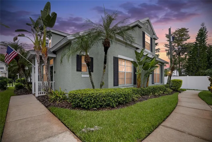 Neo-traditional architecture with classic charm and tropical Florida landscaping